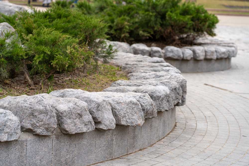 Rounded rocks with plants in a decorative hardscape design